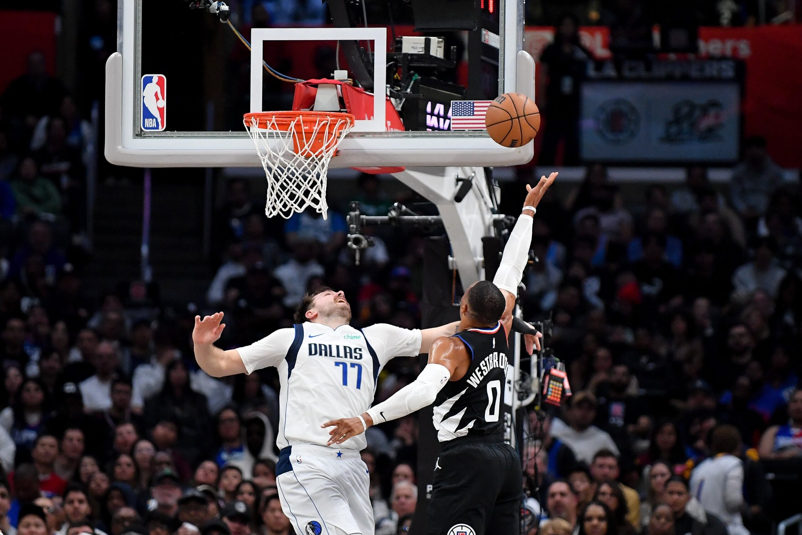 Russell Westbrook of the LA Clippers shoots the ball over Luka Doncic