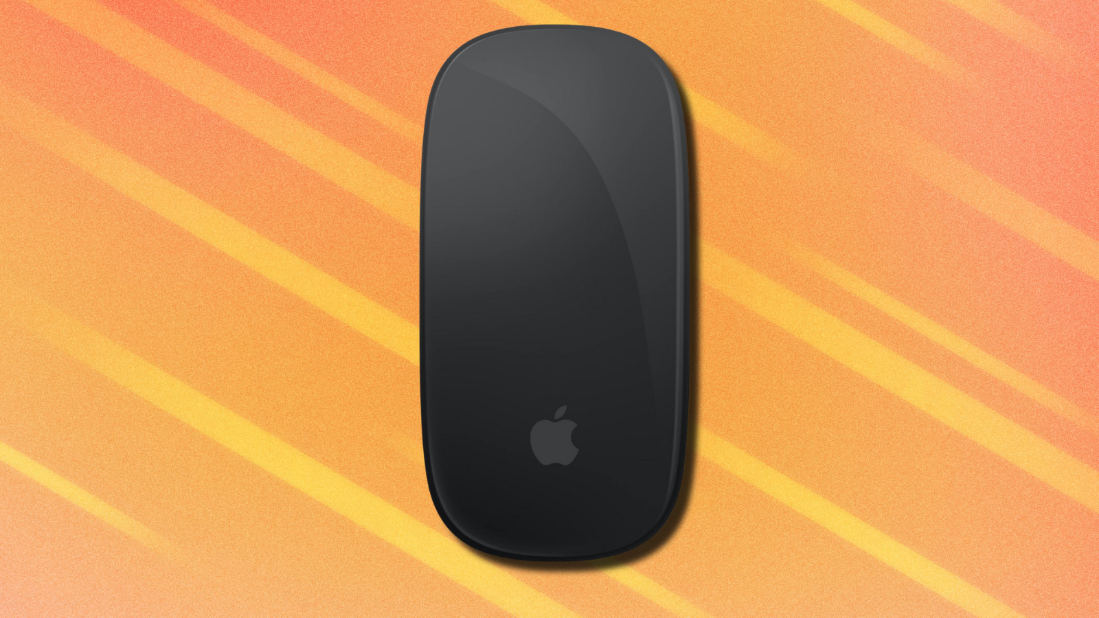 Apple Magic Mouse on orange abstract background