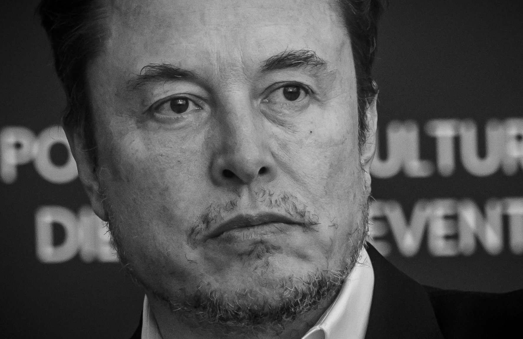 Elon Musk looking grim in black and white. 