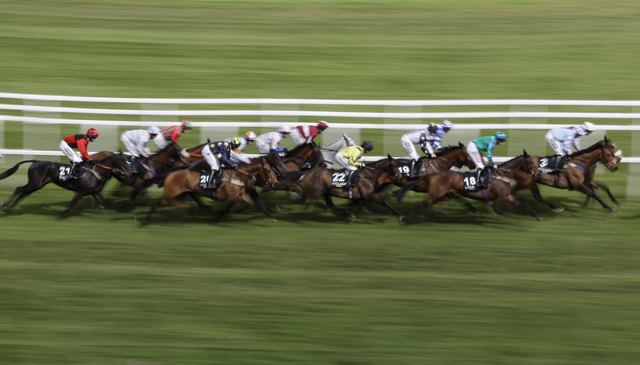 Runners in the second race, the Village Hotels Handicap Hurdle, during racing on day three of the Grand National