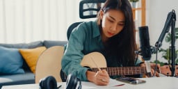 Woman writing song.