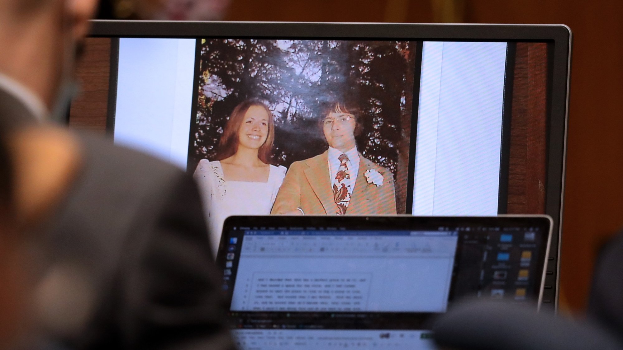 A photo of Robert Durst and former wife Kathie McCormack on their wedding day in 1973 is shown while Robert Durst takes the stand and testifies in 2021.