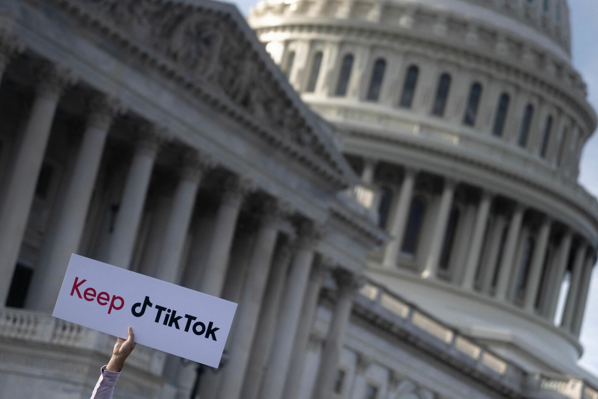 A person holds a sign during a press conference about their opposition to a TikTok ban on Capitol Hill in Washington, DC on March 22, 2023.