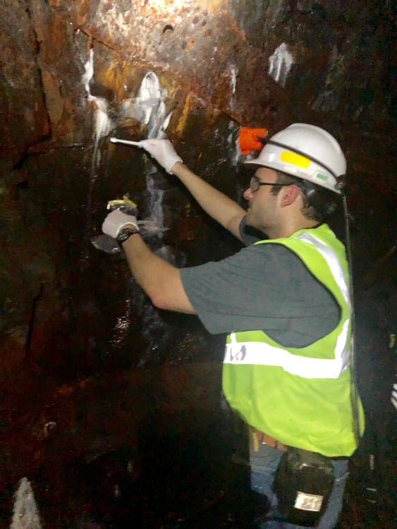 Kyle Landry searching for extremophiles in a gold mine