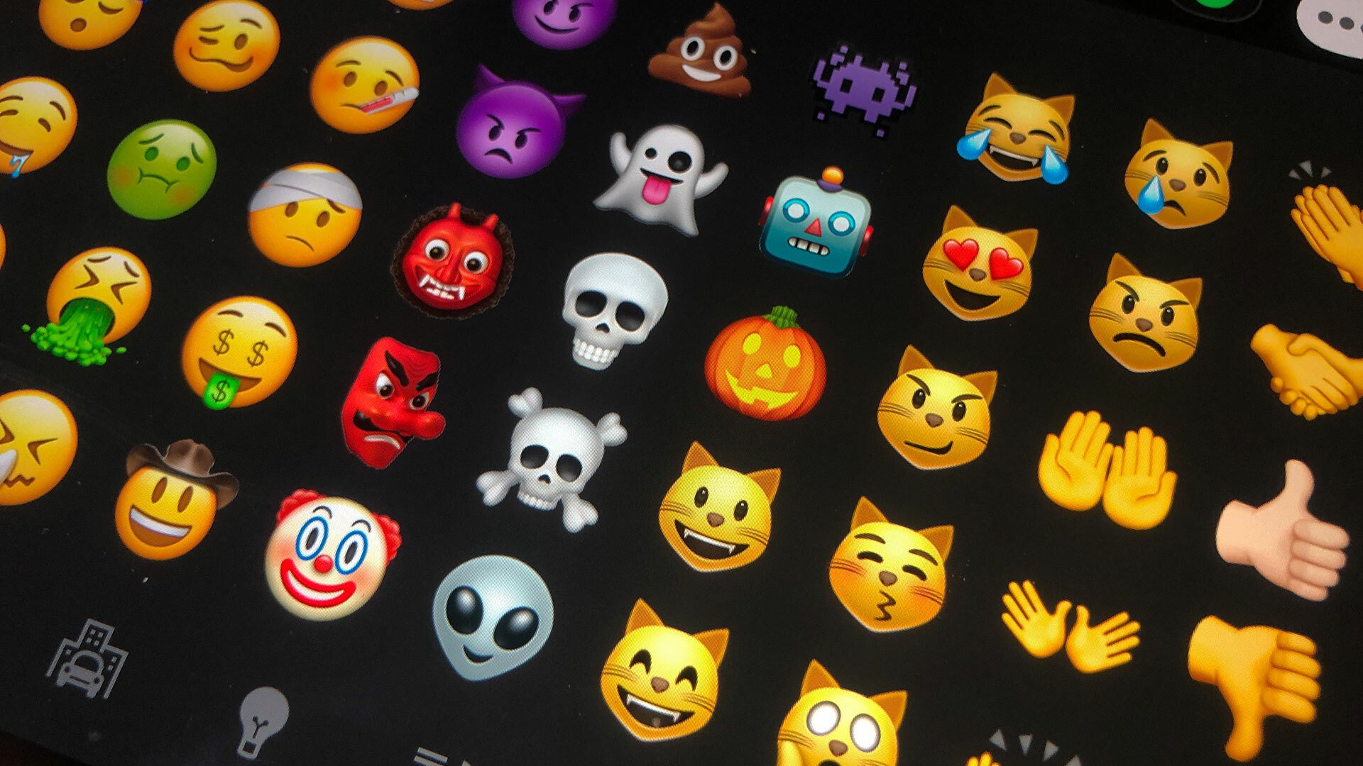 An image shows an array of different emoji on a phone screen.