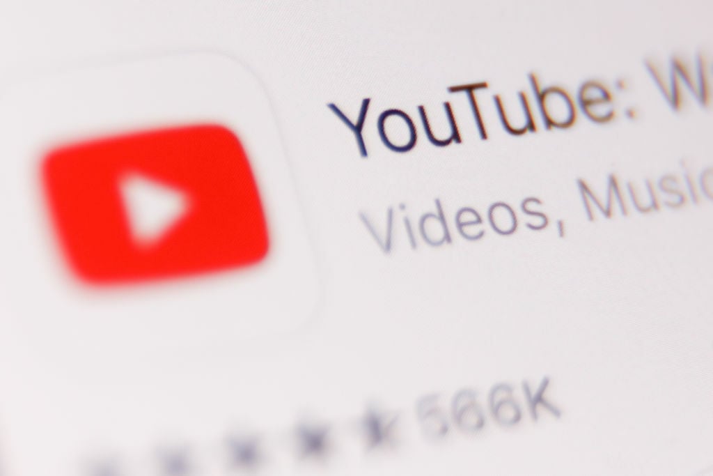 Close-up shot of the YouTube logo on a screen