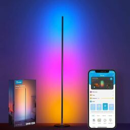 A Govee floor lamp next to its box and a smartphone displaying the Govee app