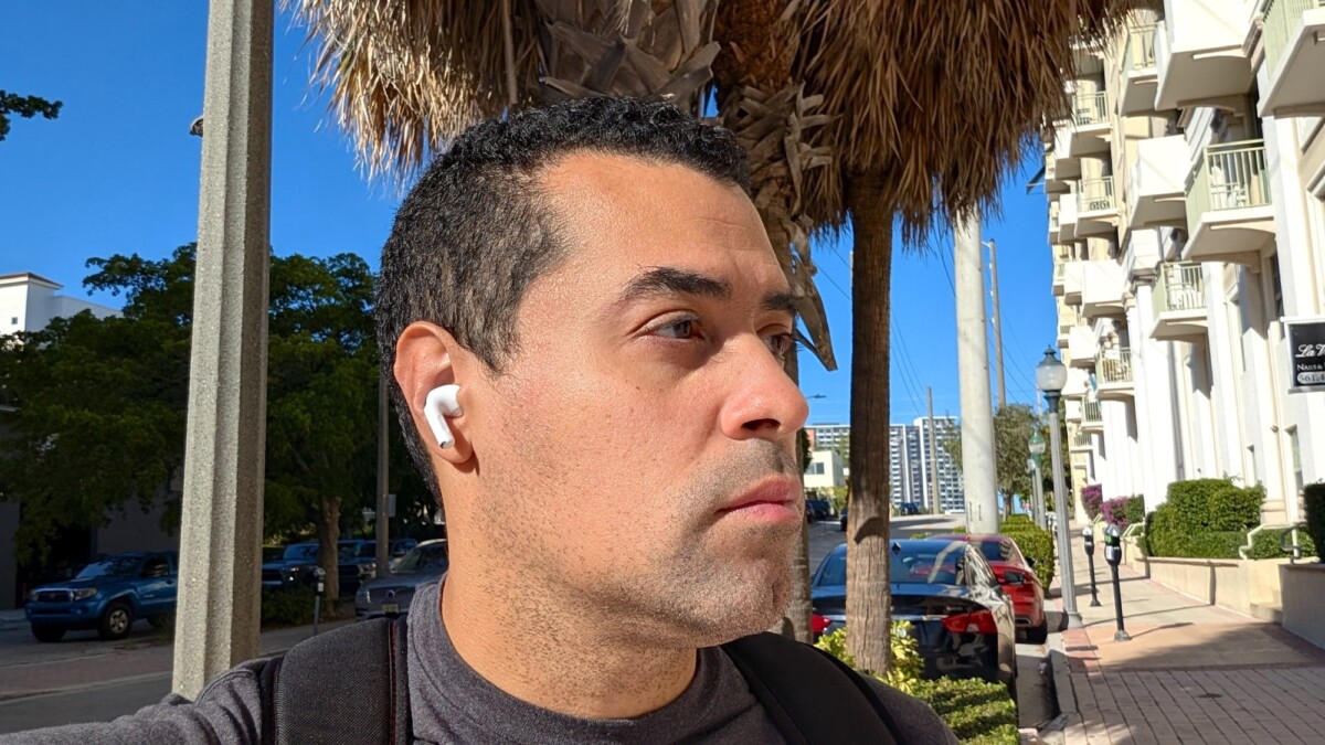 Writer and tester Alex Bracetti outside, with the AirPods Pro 3 in his ears