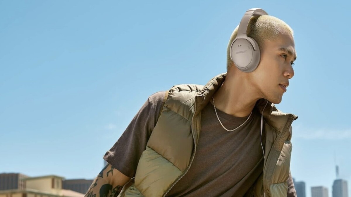 person sitting outside wearing bose headphones