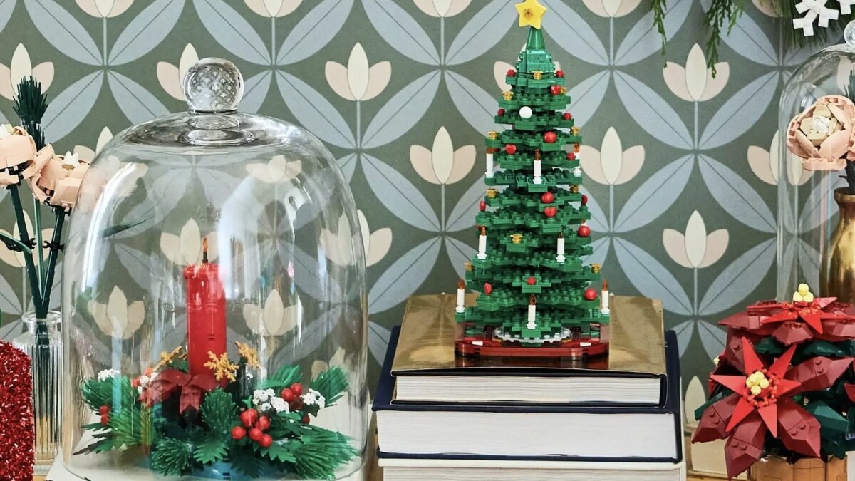 lego christmas centerpiece, christmas tree, and poinsettia sets on decorated table