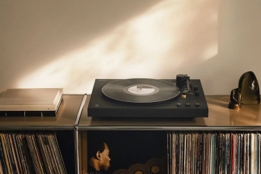 Sony PS-LX5BT wireless turntable sitting on shelf of vinyls
