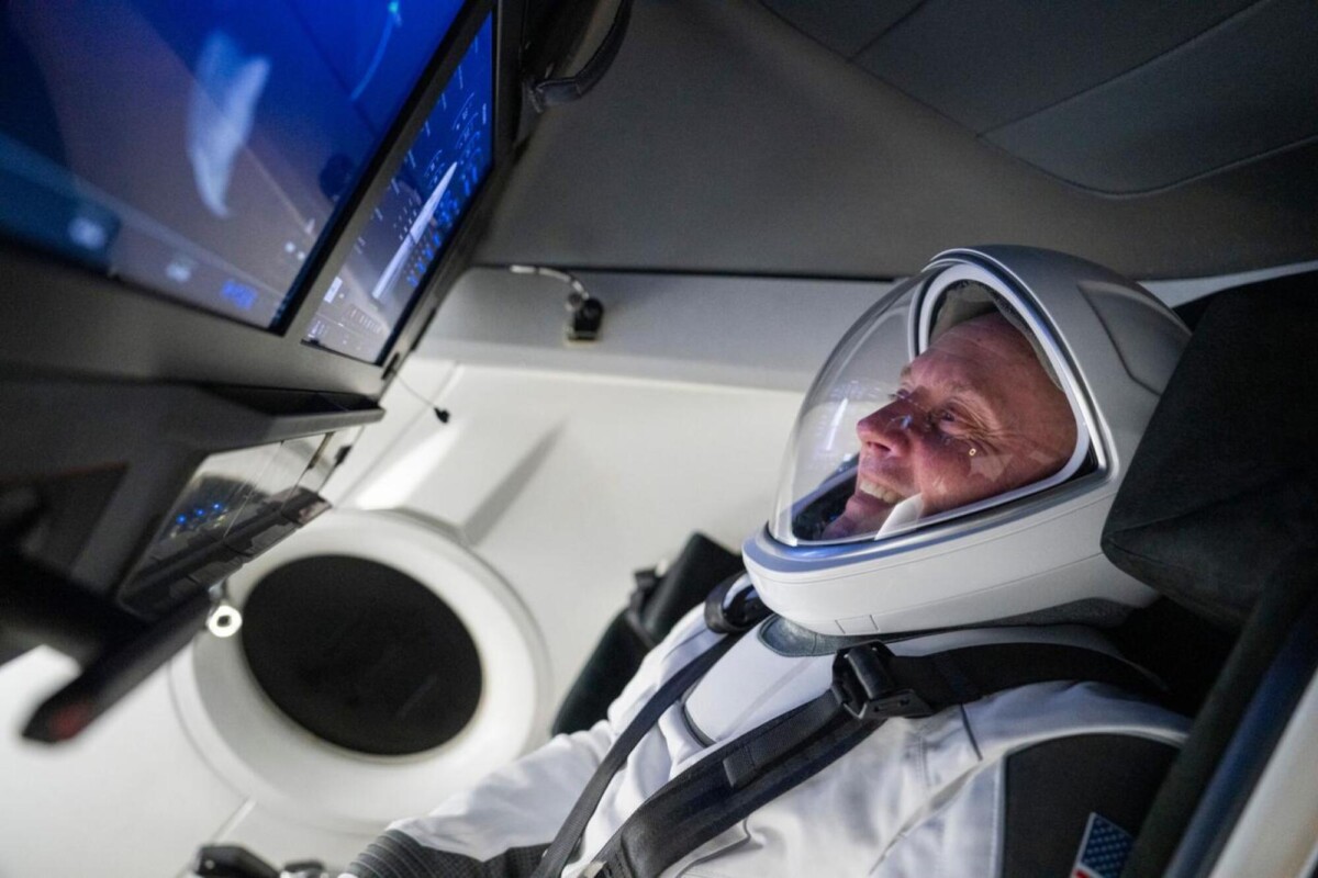 NASA astronaut Mike Fincke training inside a mock SpaceX Dragon capsule