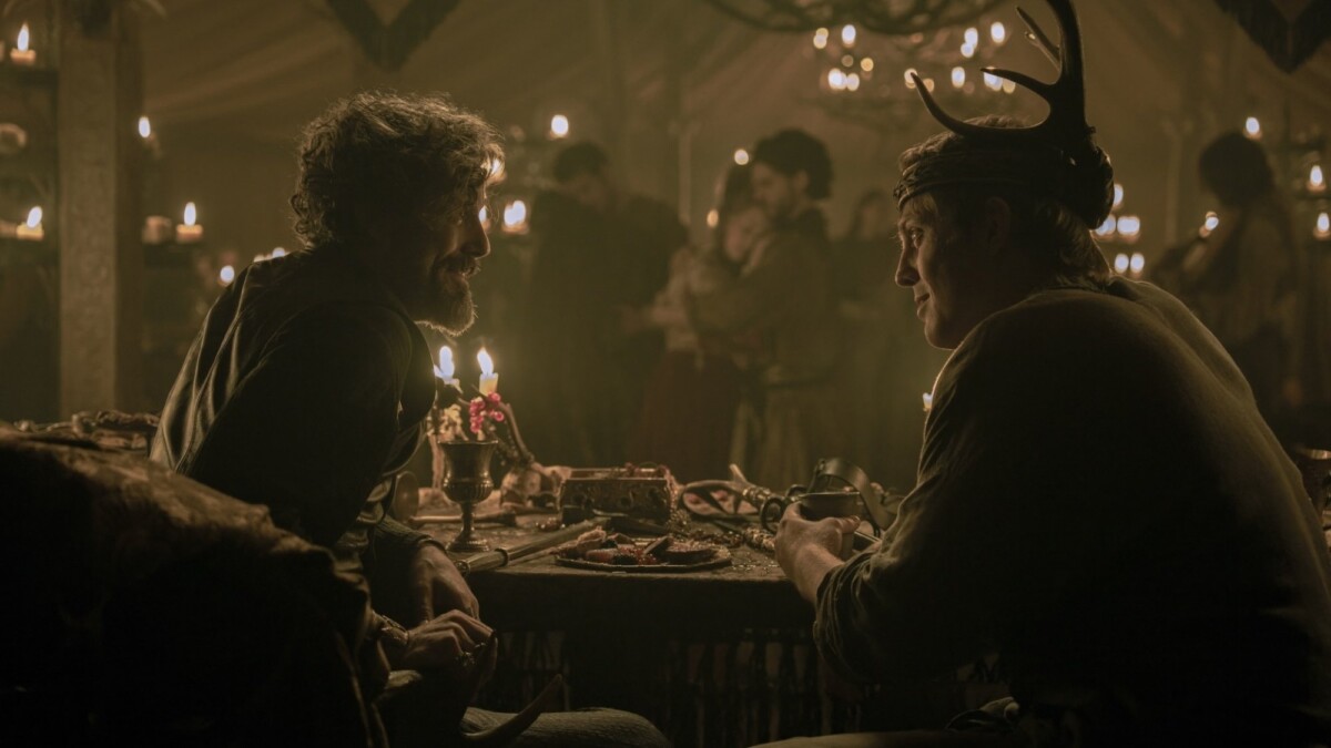 Daniel Ings as Lyonel Baratheon and Peter Claffey as Dunk, feasting in a tent, in "A Knight of the Seven Kingdoms."