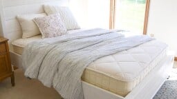 the Naturepedic Serenade Organic Hybrid Mattress in a bedroom