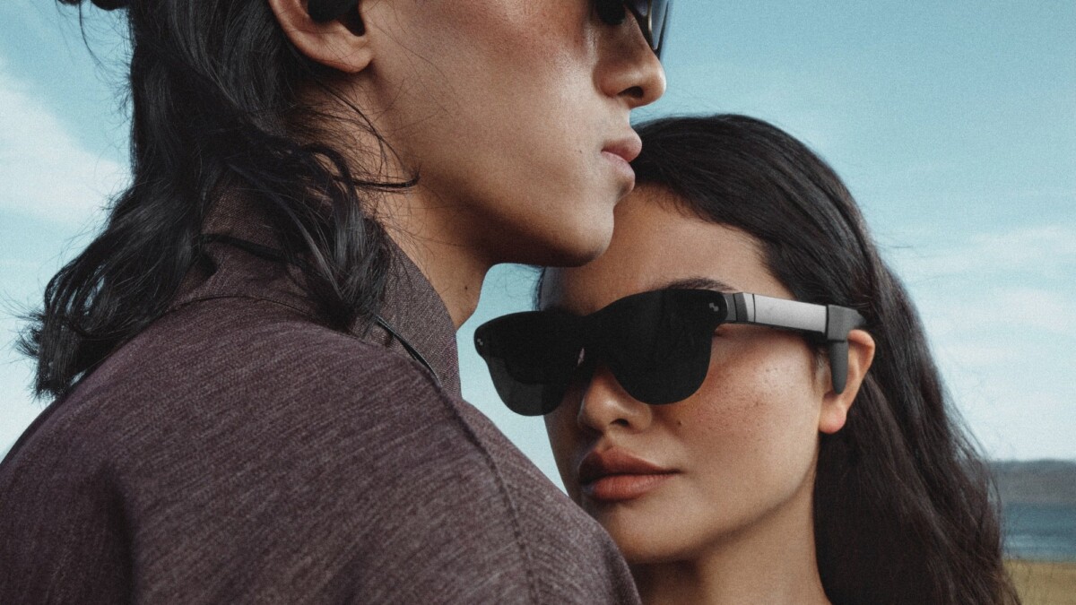models wearing tcl rayneo air 4 pro smart glasses