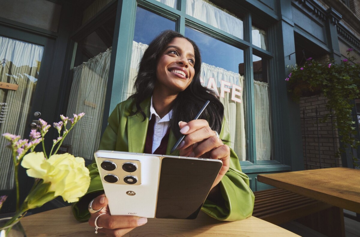 woman using motorola razr fold with moto pen